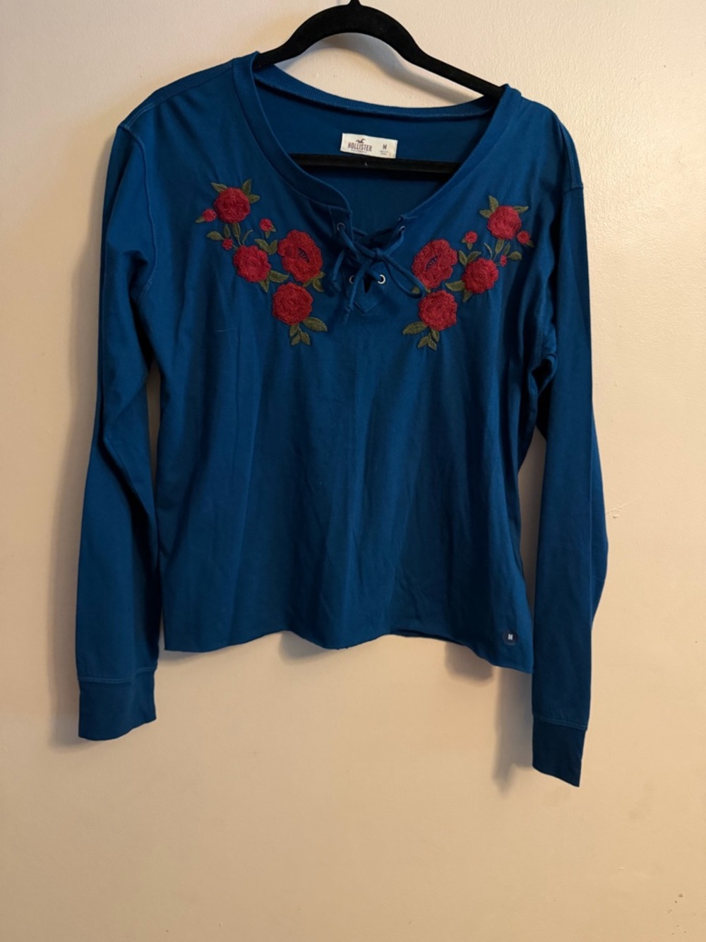 Hollister Teal Lace-Up Long Sleeve Top with Red Rose Embroidery